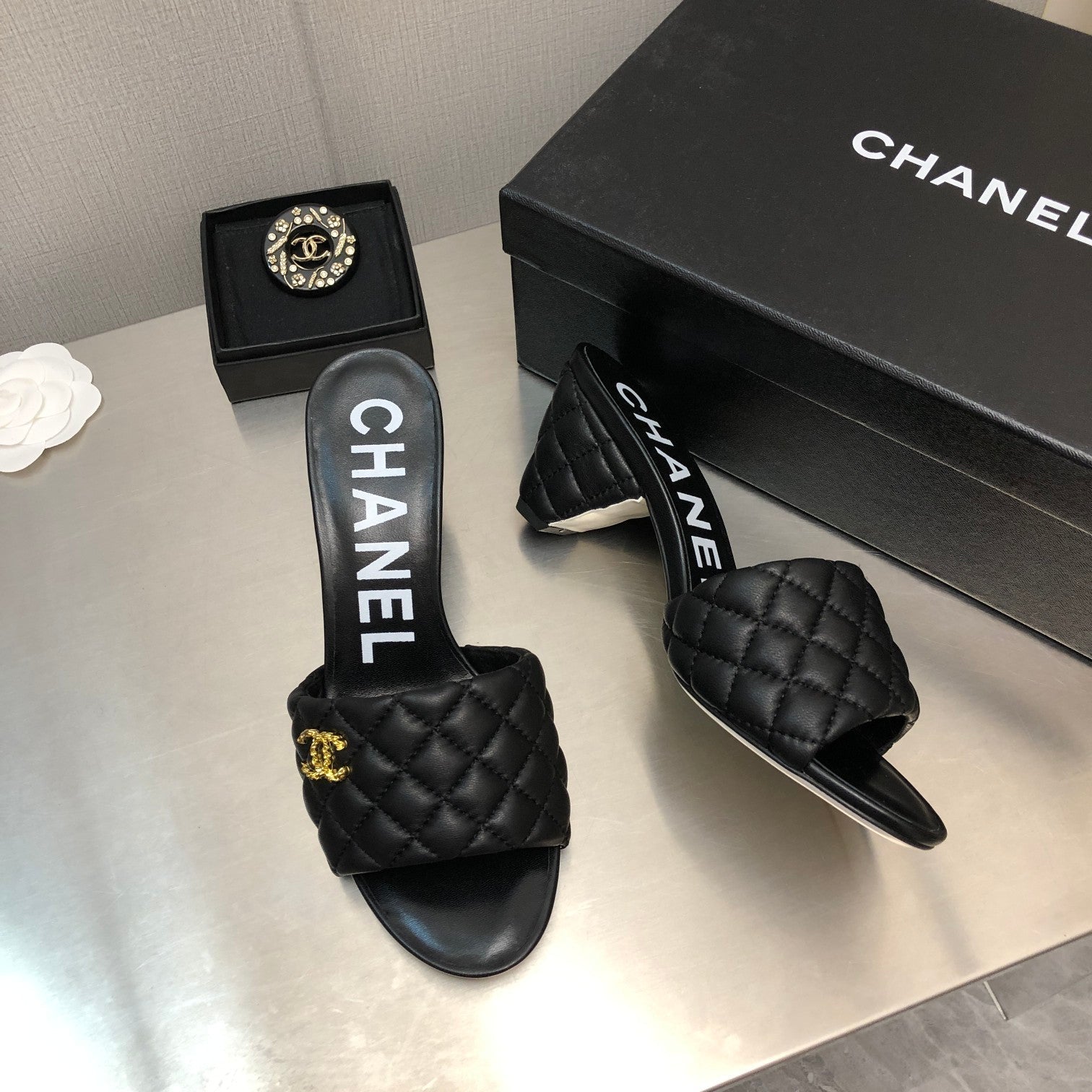 CHANEL DIAMOND-QUILTED 6 CM SANDALS IN BLACK LAMBSKIN