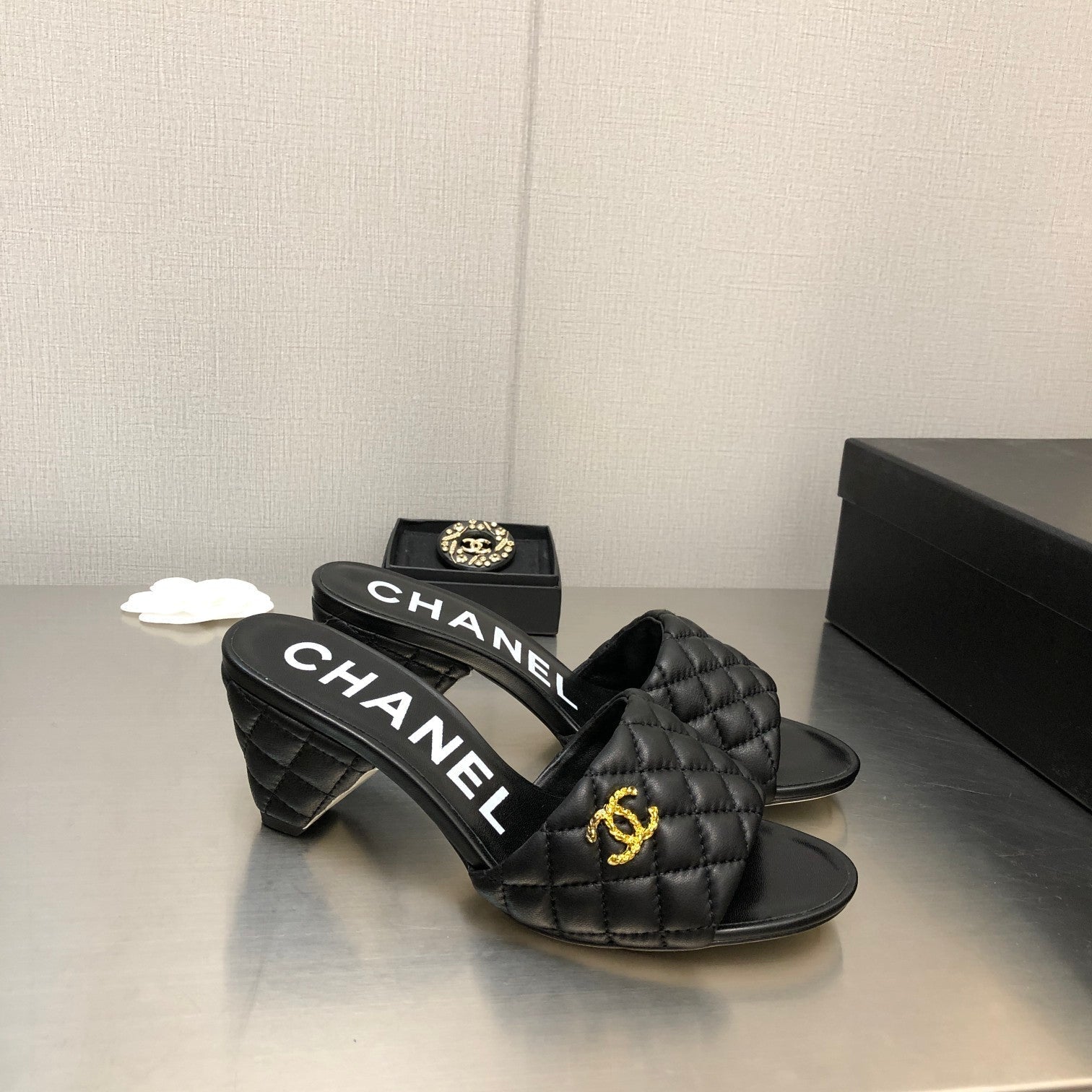 CHANEL DIAMOND-QUILTED 6 CM SANDALS IN BLACK LAMBSKIN