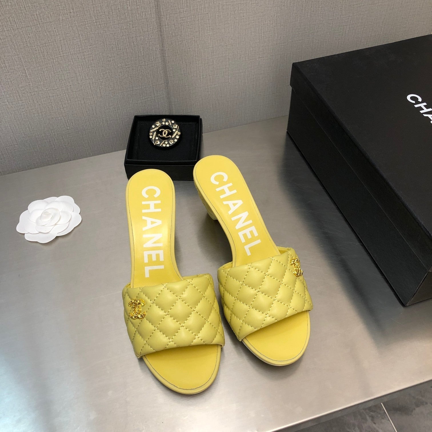 CHANEL DIAMOND-QUILTED 6 CM SANDALS IN BRIGHT YELLOW LAMBSKIN