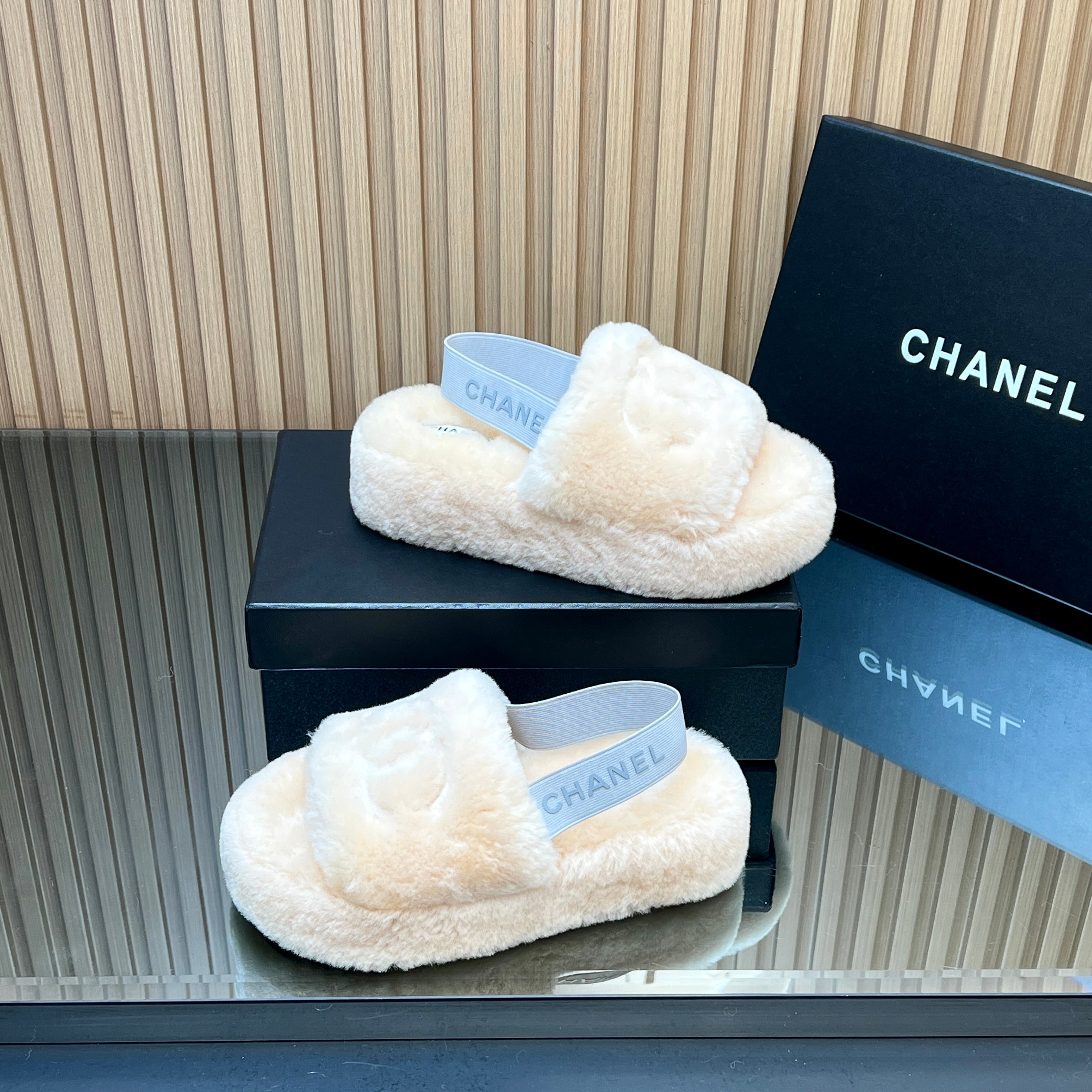 CHANEL 25S THICK-SOLED FURRY SLIPPERS WITH ELASTIC STRAPS IN BEIGE FUR