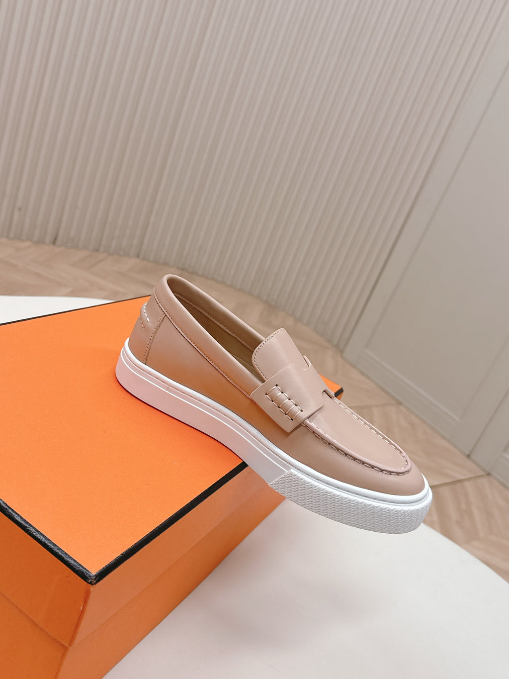 HERMES 25S SLIP-ON IN SOFT NUDE PINK LAMBSKIN