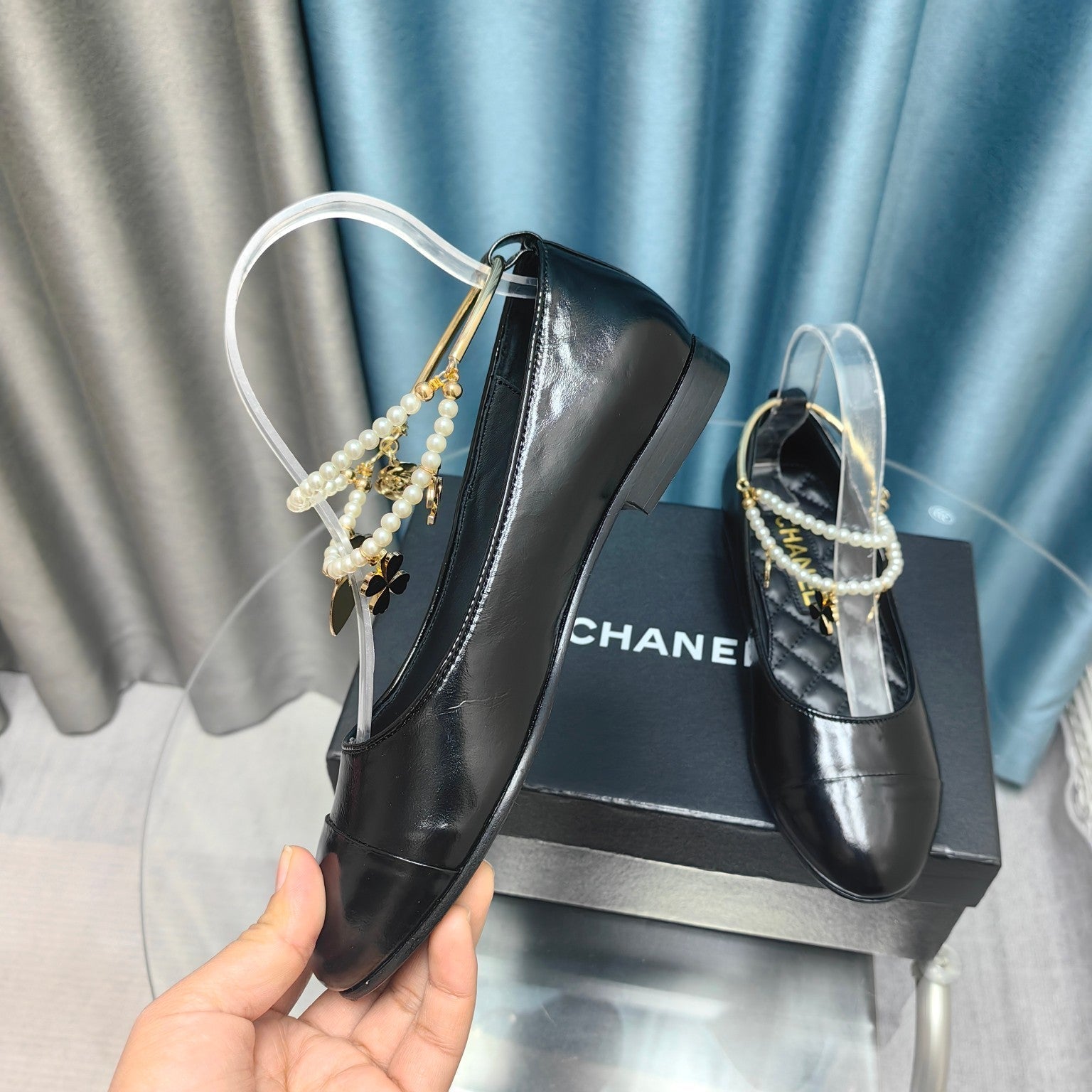 CHANEL MARY JANE WITH PEARL STRAP IN GLOSSY BLACK LAMBSKIN