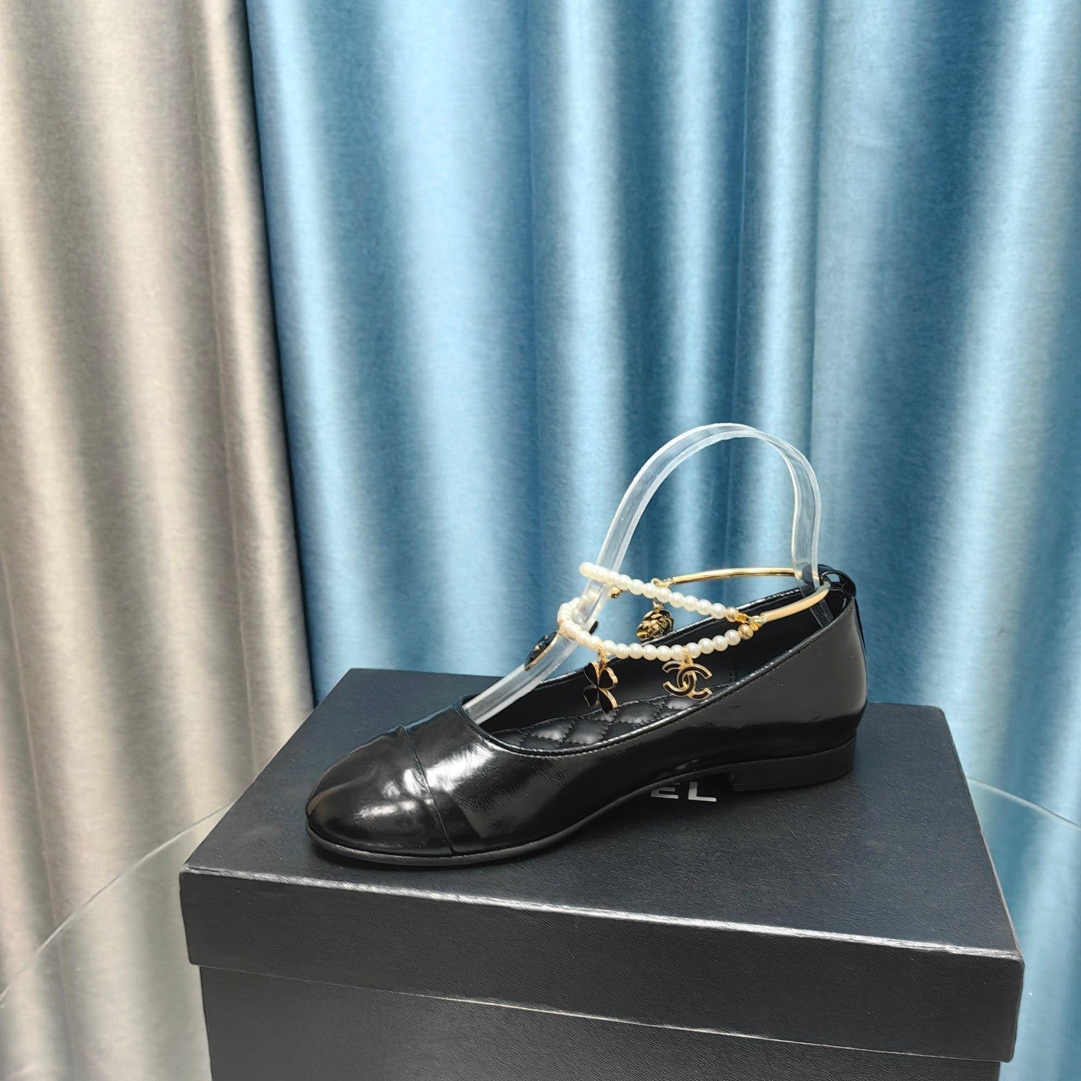 CHANEL MARY JANE WITH PEARL STRAP IN GLOSSY BLACK LAMBSKIN