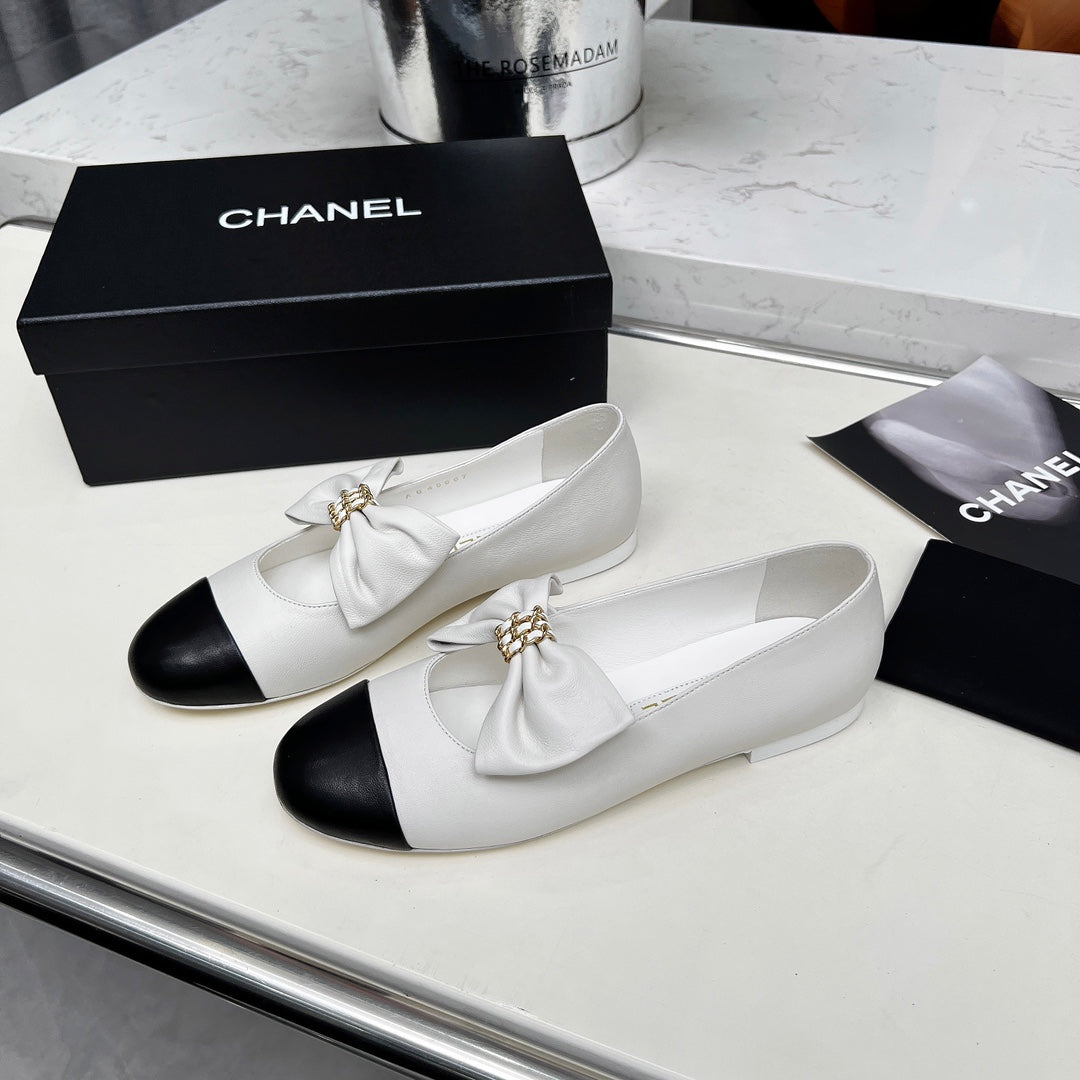 CHANEL 25S MARY JANES IN WHITE MIX BLACK CALFSKIN WITH BOW GOLD HARDWARE