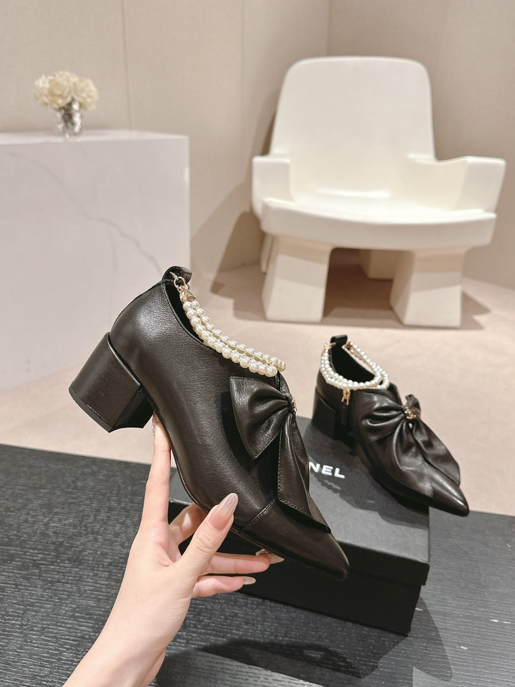 CHANEL SHORT BOOTS IN BLACK SHEEPSKIN WITH BOW