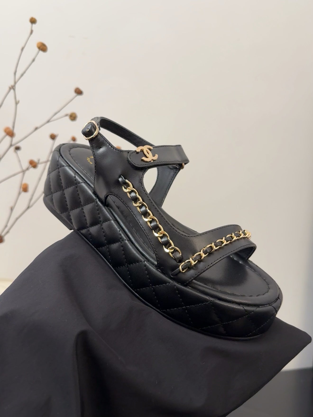 CHANEL THICK-SOLED SANDALS 55 MM IN BLACK CALFSKIN