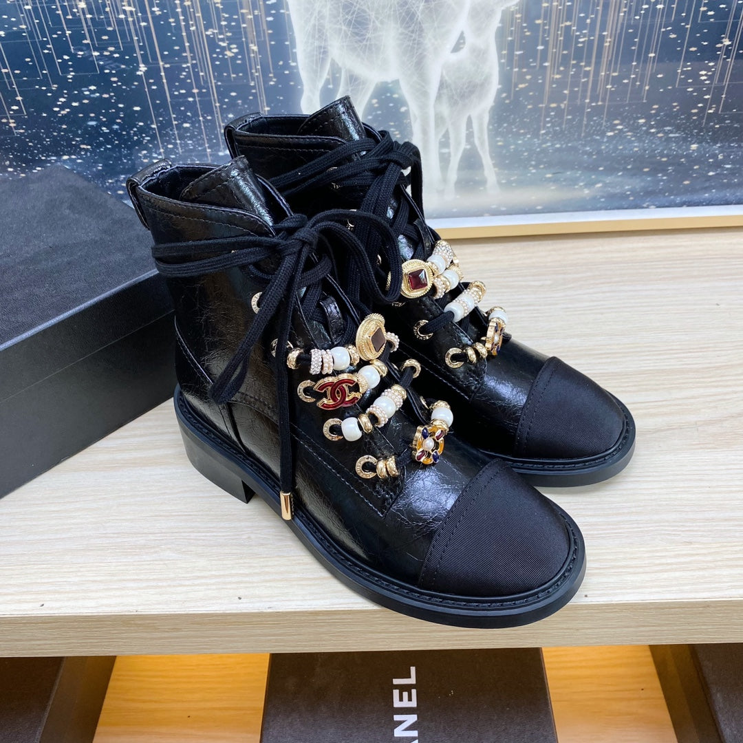 CHANEL COMBAT BOOTS IN BLACK WRINKLED CALFSKIN AND GROSGRAIN WITH FAUX PEARL