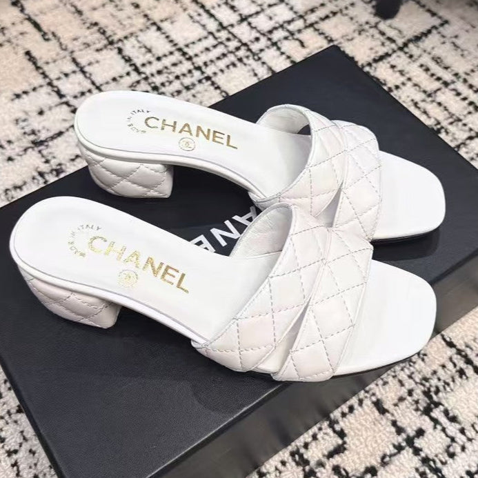 CHANEL MID HEEL MULES IN WHITE SHEEPSKIN